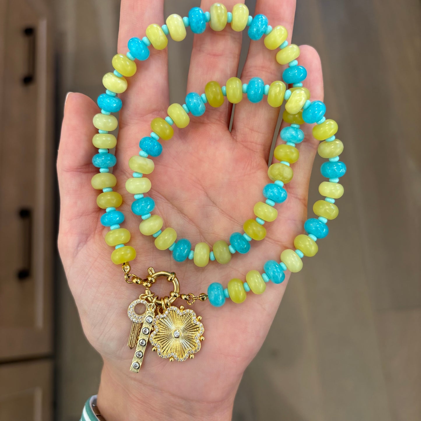 Serena charm necklace with chartreuse and blue stones