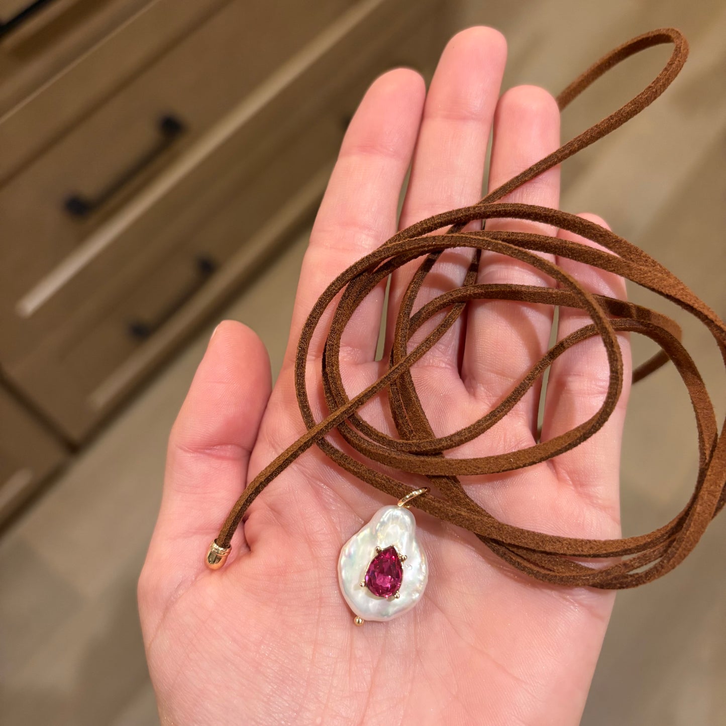 Freshwater pearl necklace with hot pink stone