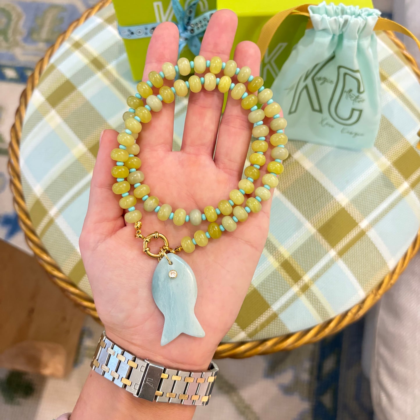 Francesca the fish charm necklace with chartreuse stones