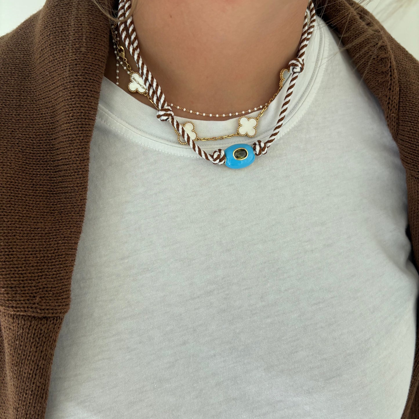 Brown striped cord necklace with blue stone