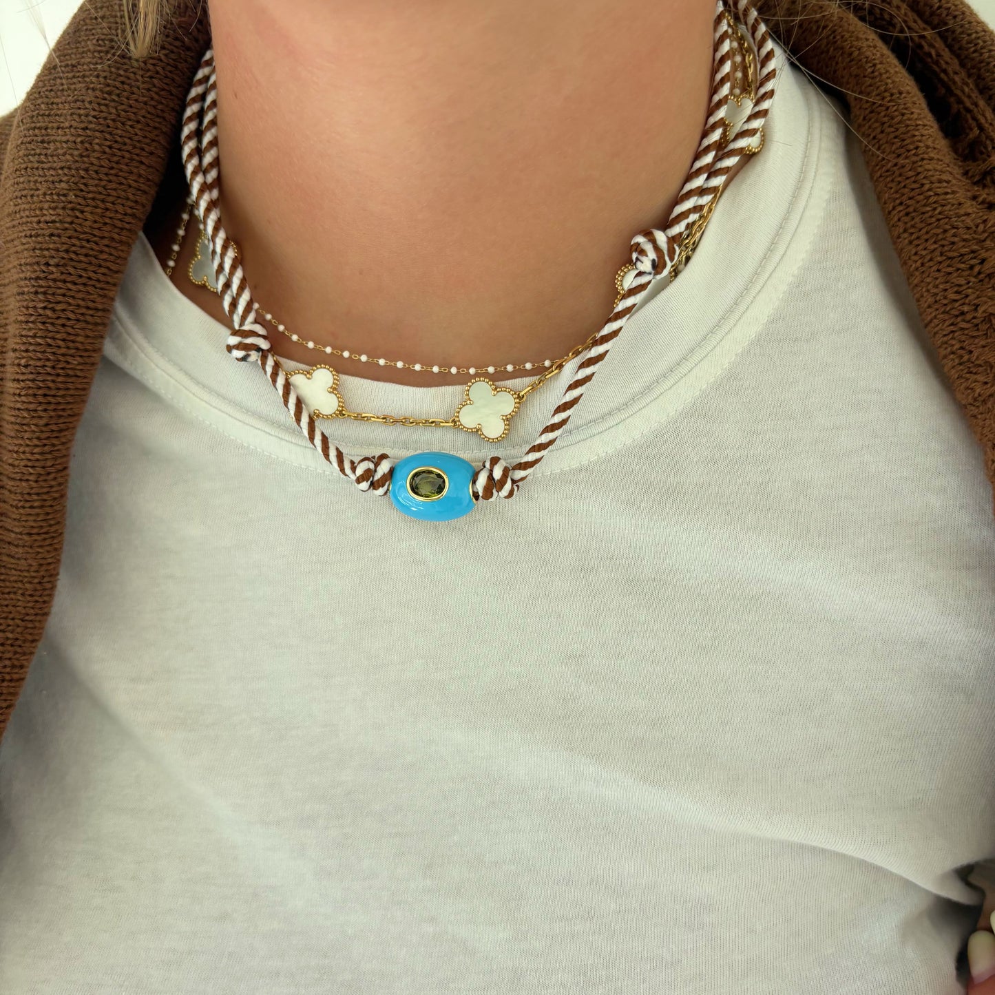 Brown striped cord necklace with blue stone