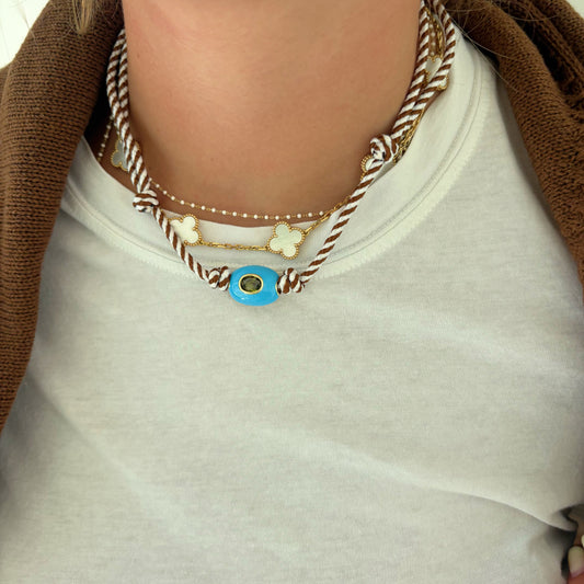 Brown striped cord necklace with blue stone