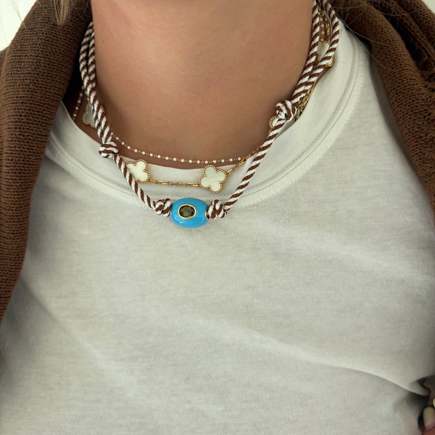 Brown striped cord necklace with blue stone