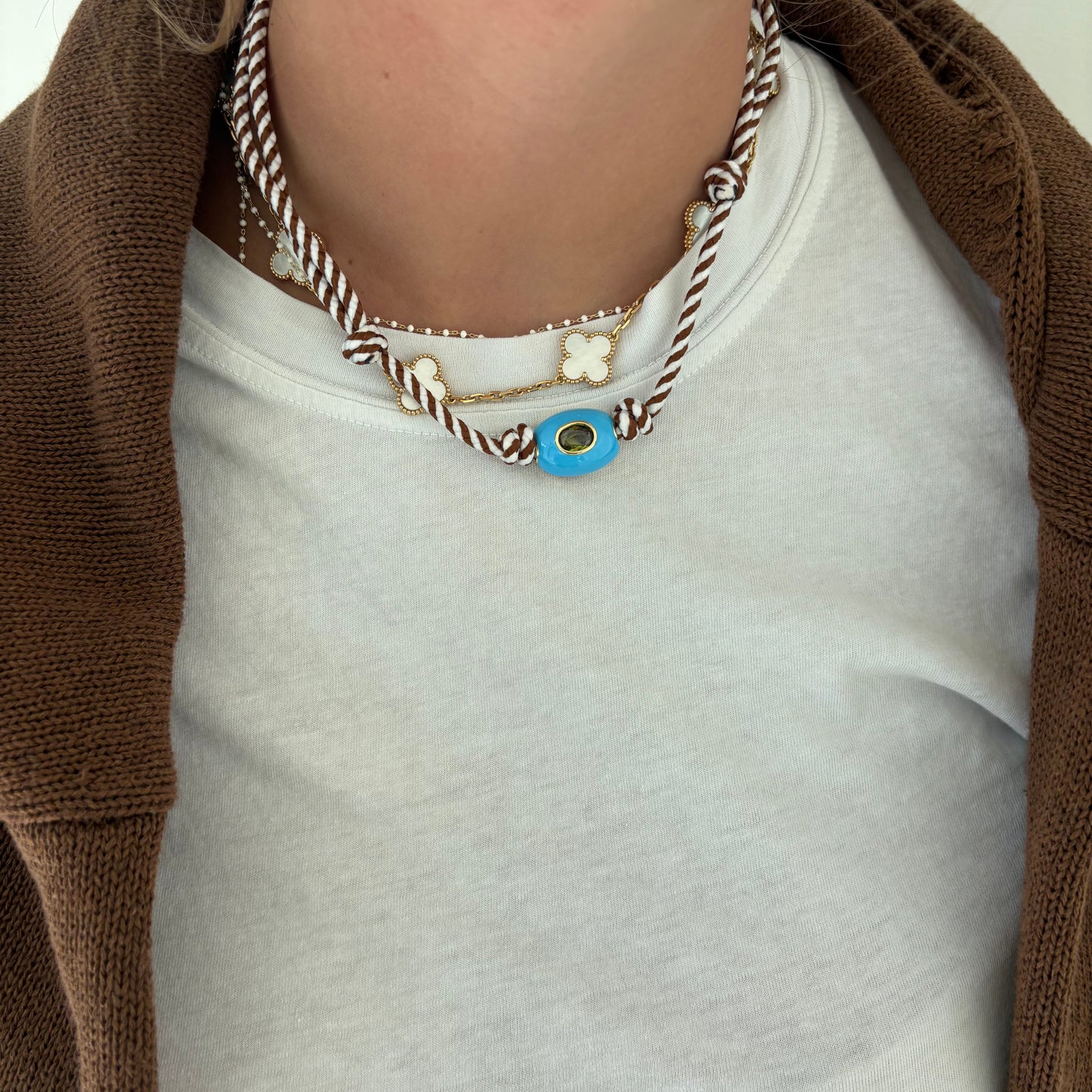 Brown striped cord necklace with blue stone
